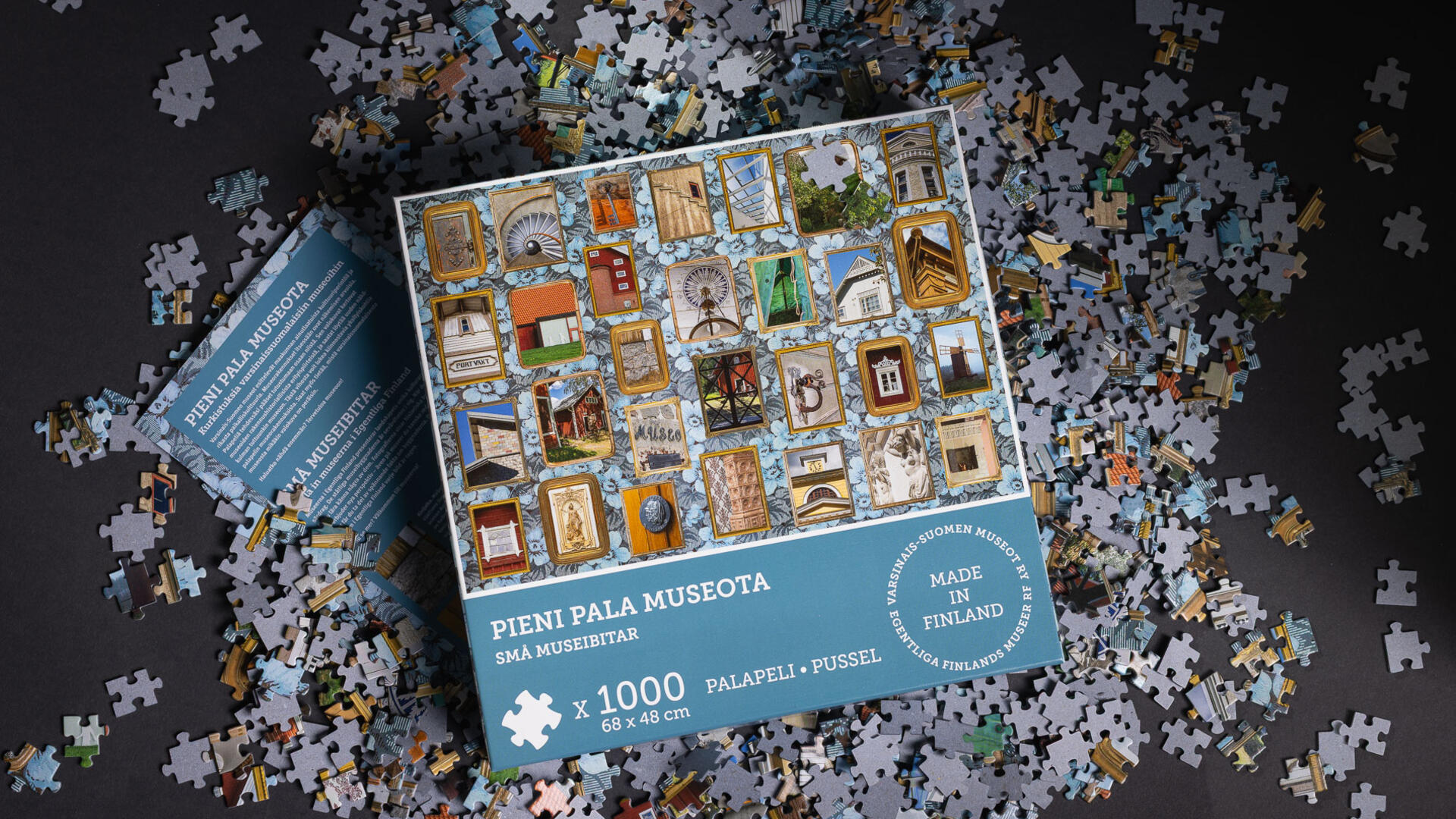 palapeliarasia ja palapelin paloja pöydällä