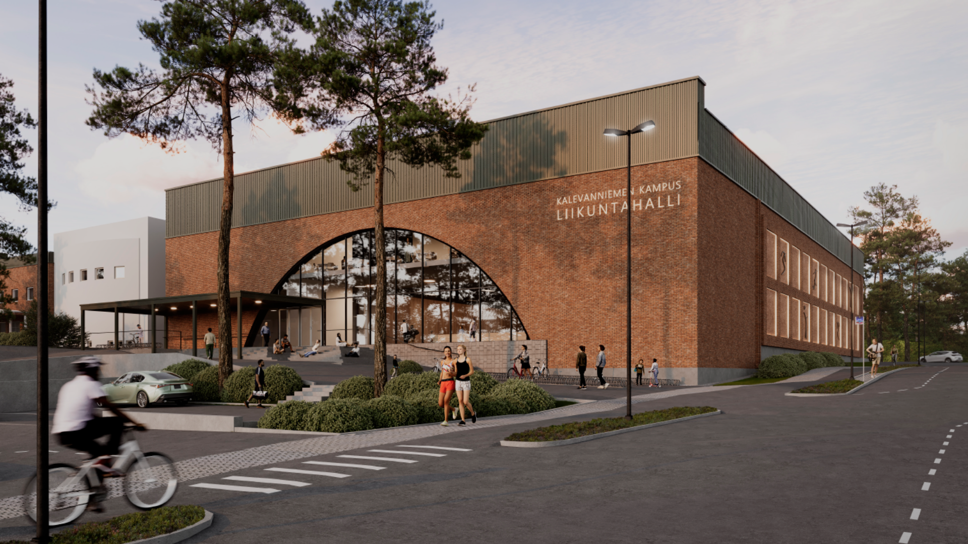 Kalevanniemen uuden liikuntahallin havainnekuva, jossa suuret kaari-ikkunat pääsisäänkäynnillä.