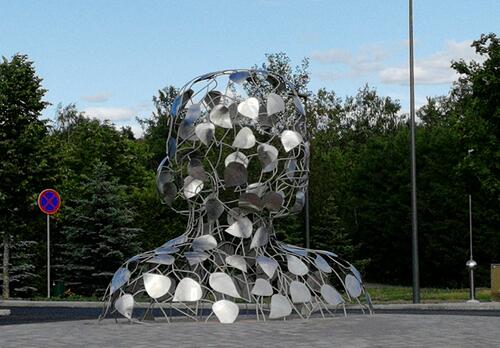 taideteos, jossa metallista tehty runko ja päälle kiinnitetyt lehdet muodostavat naisen rintakuvan